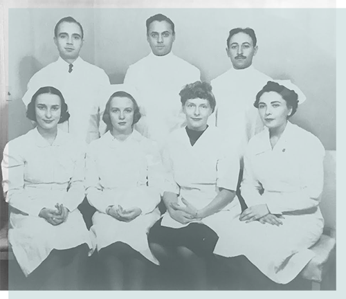 Dr. Jerome M. Schweitzer (center top row), Dorothy Schweitzer
(second from right bottom row) and Staff, 1930s