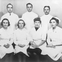 Dr. Jerome M. Schweitzer (center top row), Dorothy Schweitzer (second from right bottom row) and Staff, 1930's