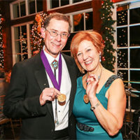 Dr. Kenneth Schweitzer, as GNYAP President, and Cathy Dolan Schweitzer (wife) displaying presidential medallions. The Boathouse, Central Park, 2016